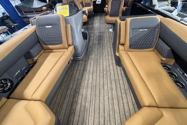 Slide: The Image of Luxurious interior of 2026 Harris Sunliner 230 pontoon boat with tan seating and modern design. - 7
