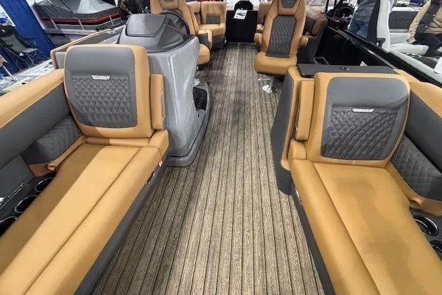 Slide: The Image of Luxurious interior of 2026 Harris Sunliner 230 pontoon boat with tan and gray seating. - 8