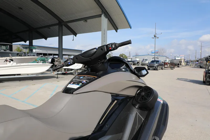 Slide: The Image of 2025 Yamaha WaveRunner FX HO parked in a marina with boats in the background. - 15