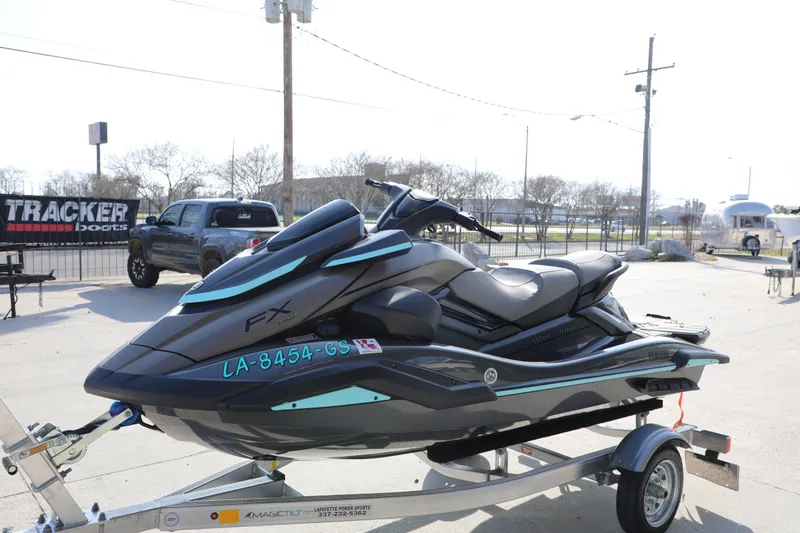 Slide: The Image of 2025 Yamaha WaveRunner FX HO jet ski on trailer in outdoor setting. - 17