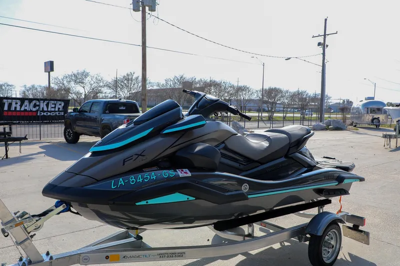 Slide: The Image of 2025 Yamaha WaveRunner FX HO on trailer, parked outdoors in a sunny setting. - 9