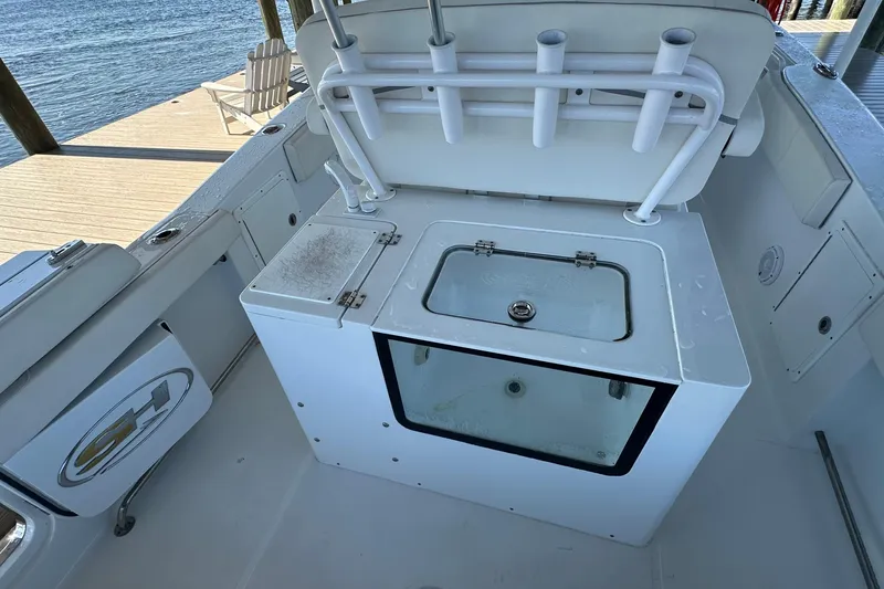 Slide: The Image of 2024 Sea Hunt Gamefish 30 boat with forward seating and fishing rod holders. - 11