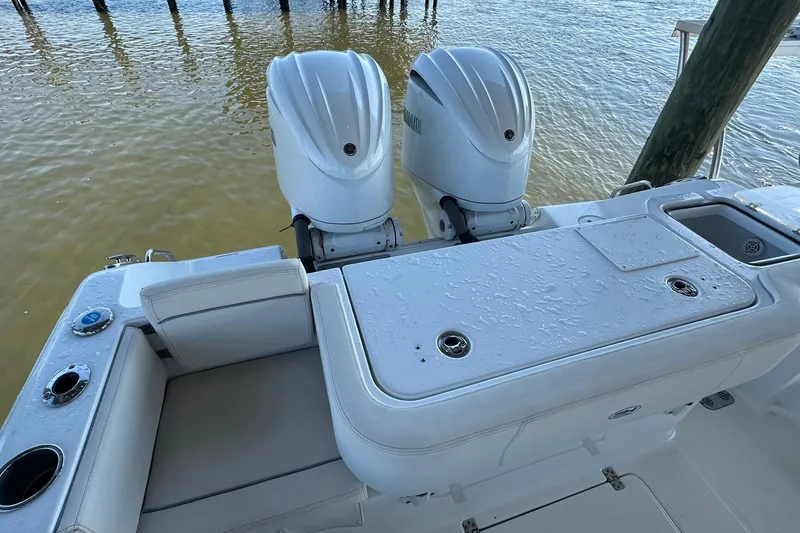 Slide: The Image of 2024 Sea Hunt Gamefish 30 boat with dual outboard motors and forward seating. - 12