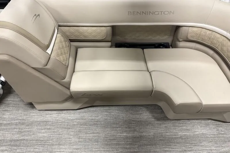 Slide: The Image of Luxurious seating in 2026 Bennington 22 SSRSE pontoon boat, featuring elegant beige upholstery. - 10