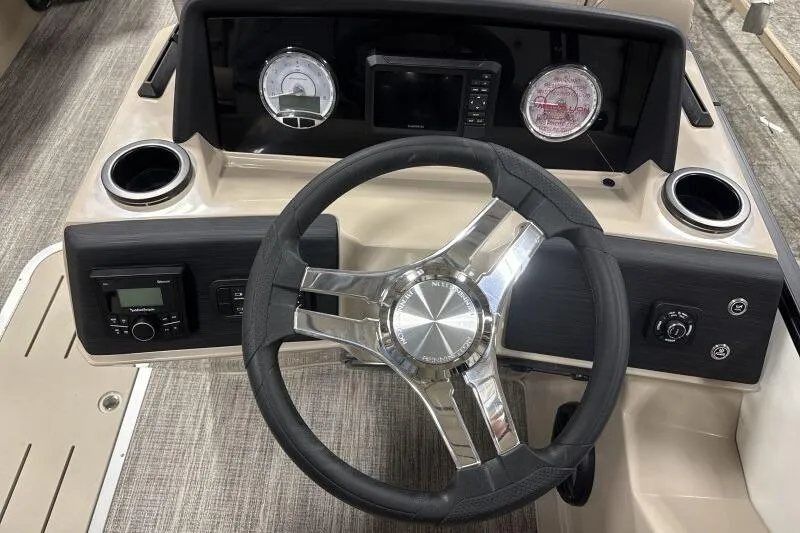 Slide: The Image of Steering console of 2026 Bennington 22 SSRSE boat with modern controls and gauges. - 11
