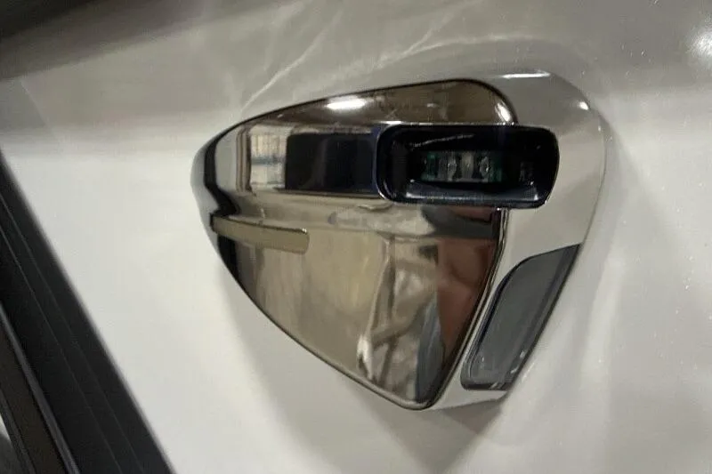 Slide: The Image of Close-up of a 2026 Bennington 22 SSRSE boat's sleek chrome detail. - 16