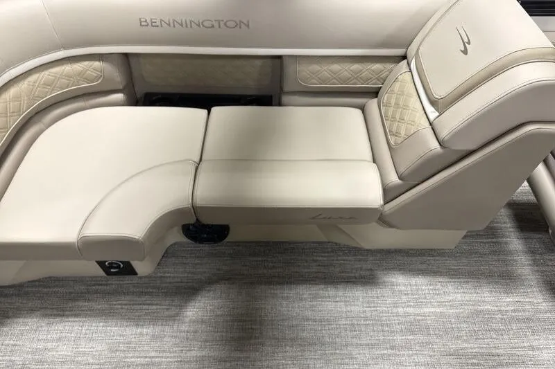 Slide: The Image of 2026 Bennington 22 SSRSE boat interior with luxurious beige seating and quilted accents. - 9
