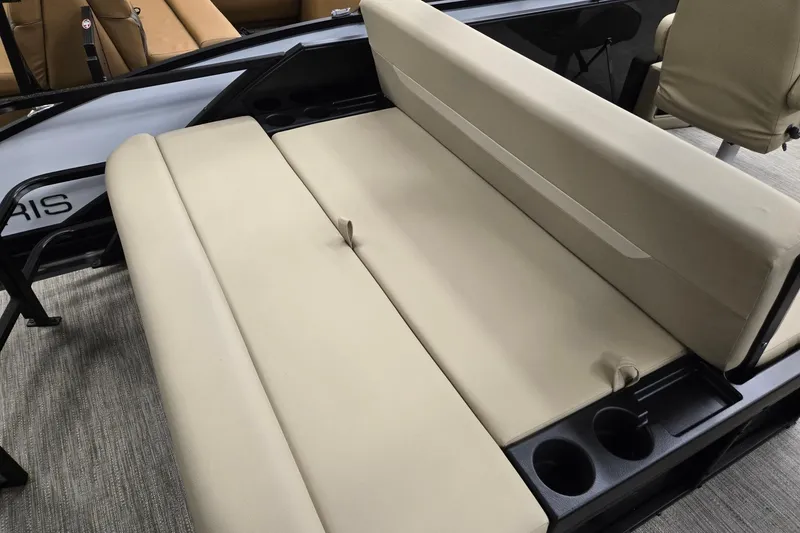 Slide: The Image of 2026 Godfrey EX 2286 SFLX boat interior with beige seating and cup holders. - 15