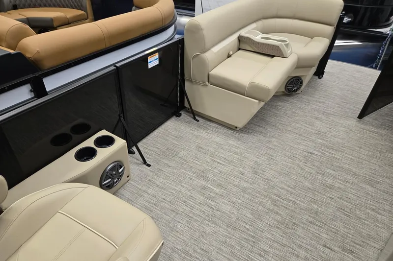 Slide: The Image of 2026 Godfrey EX 2286 SFLX boat interior with beige seating and carpet flooring. - 18