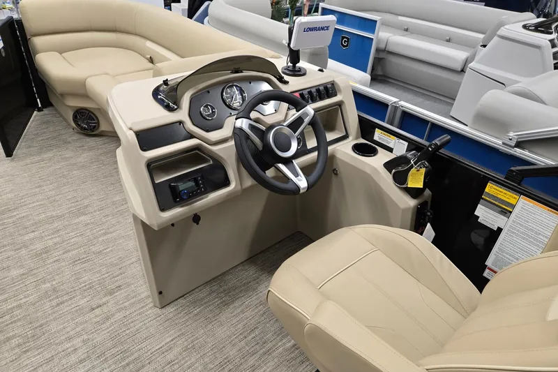 Slide: The Image of 2026 Godfrey EX 2286 SFLX boat interior with steering console and seating. - 19