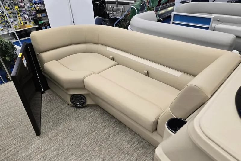 Slide: The Image of Luxurious seating on 2026 Godfrey EX 2286 SFLX pontoon boat, featuring beige upholstery. - 21