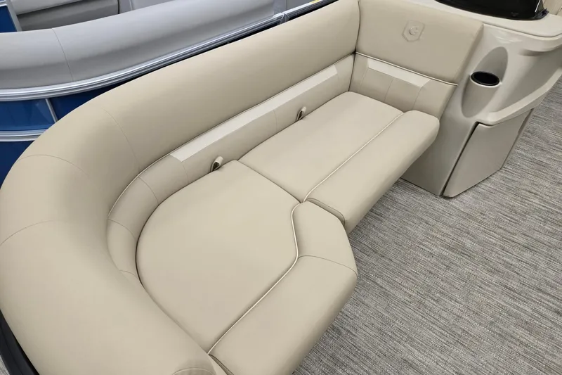 Slide: The Image of Luxurious seating on 2026 Godfrey EX 2286 SFLX pontoon boat, featuring beige upholstery. - 4