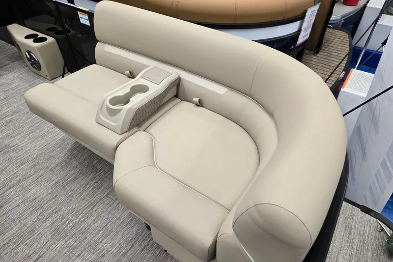 Slide: The Image of 2026 Godfrey EX 2286 SFLX boat seating with beige upholstery and integrated cup holders. - 5