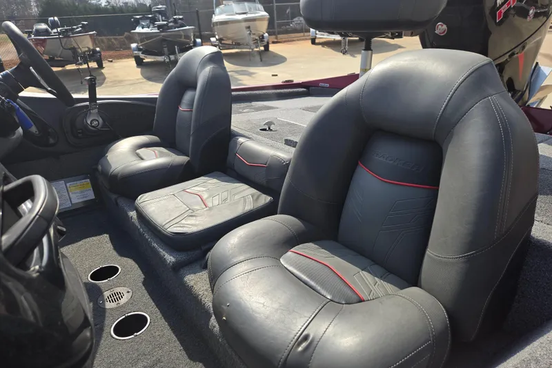Slide: The Image of 2021 Tracker Pro Team 195 TXW boat interior with gray leather seats. - 12