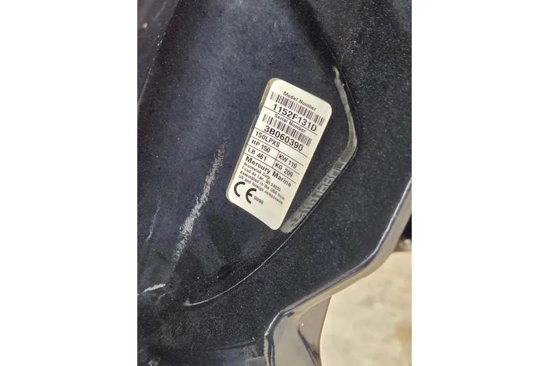 Slide: The Image of Label on 2021 Tracker Pro Team 195 TXW boat engine, displaying model and serial numbers. - 16