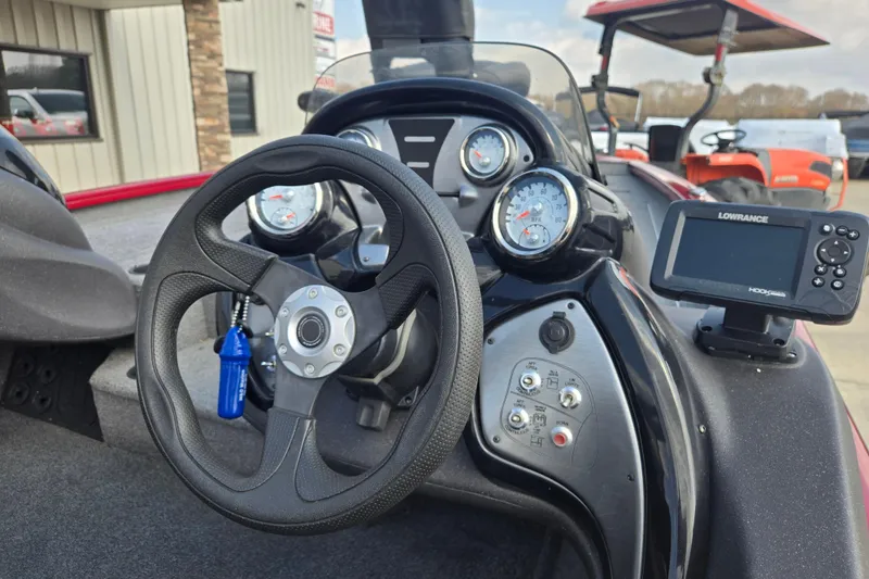 Slide: The Image of Steering console of 2021 Tracker Pro Team 195 TXW with gauges and Lowrance fishfinder. - 17