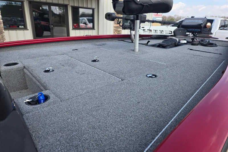 Slide: The Image of 2021 Tracker Pro Team 195 TXW boat deck with fishing equipment and storage compartments. - 18