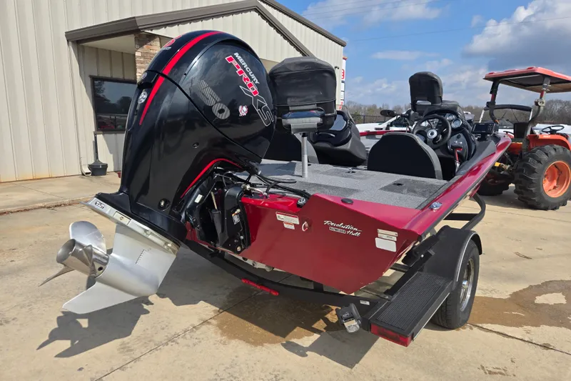 Slide: The Image of 2021 Tracker Pro Team 195 TXW boat with Mercury engine, parked outdoors. - 3