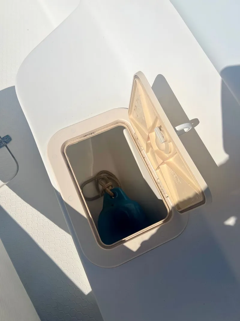 Slide: The Image of Open storage compartment on a 2006 Concept 27 boat. - 10