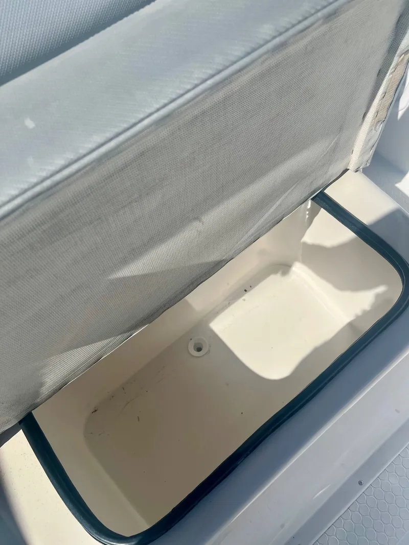 Slide: The Image of Open storage compartment in a 2006 Concept 27 boat. - 13