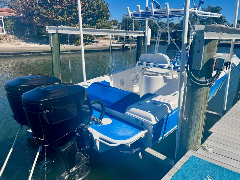 Slide: The Image of 2006 Concept 27 boat with dual outboard motors at dock. - 2