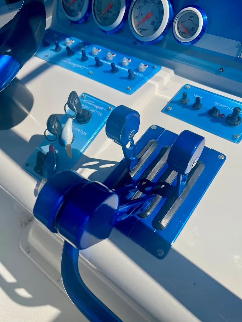 Slide: The Image of Blue control console of a 2006 Concept 27 boat. - 23