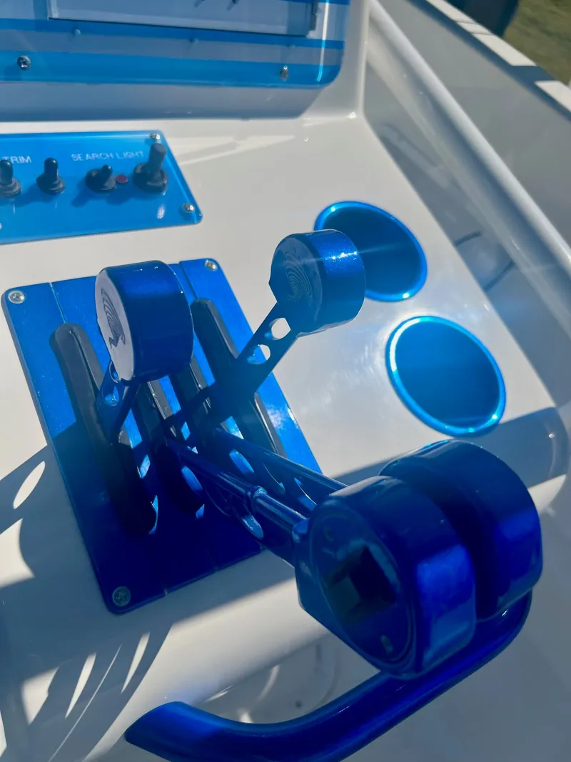 Slide: The Image of Blue control levers on a boat, Concept 27 model, year 2006. - 24