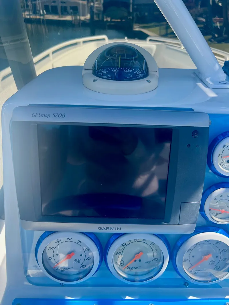 Slide: The Image of Boat dashboard with Garmin GPSmap 5208 and compass, Concept 27, 2006. - 25