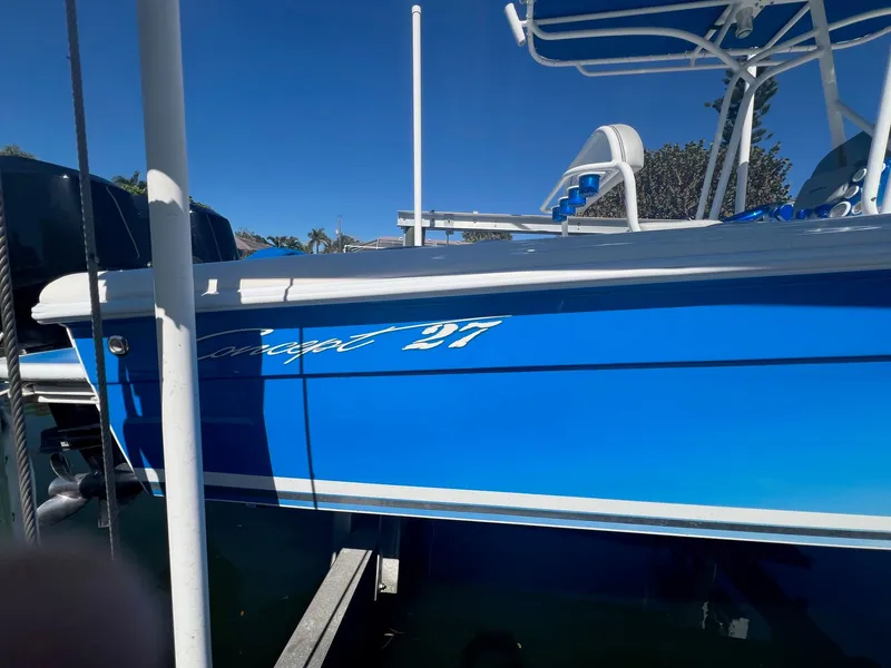 Slide: The Image of Blue Concept 27 boat from 2006 docked at marina. - 35
