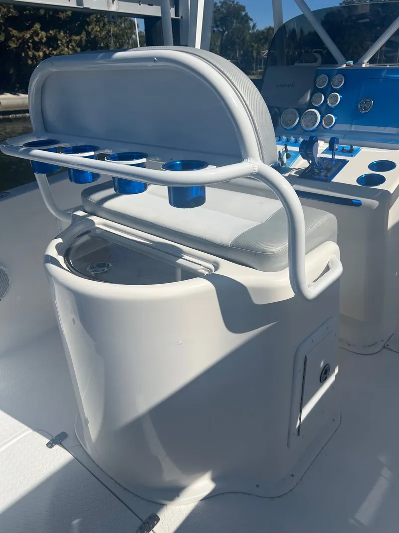 Slide: The Image of Interior of a 2006 Concept 27 boat with seating and control console. - 7