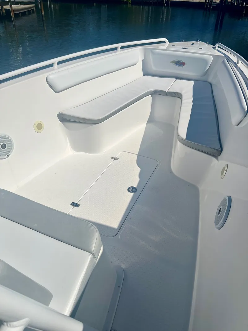 Slide: The Image of Interior of a 2006 Concept 27 boat with white seating. - 9