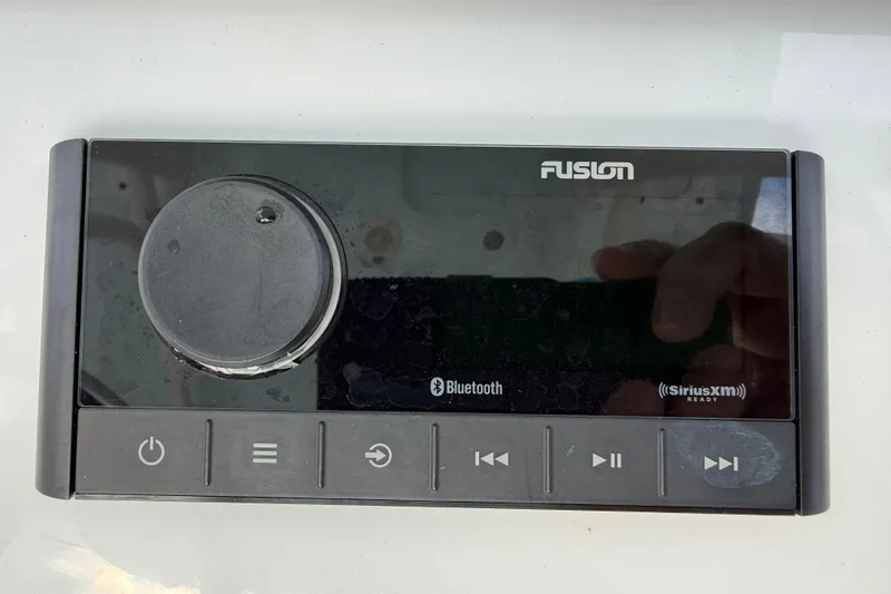 Slide: The Image of Fusion audio system with Bluetooth and SiriusXM, featured in 2023 Sportsman Open 232 Center Console. - 11