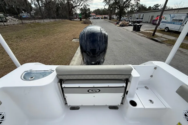 Slide: The Image of 2023 Sportsman Open 232 Center Console boat with rear seating and engine view. - 14