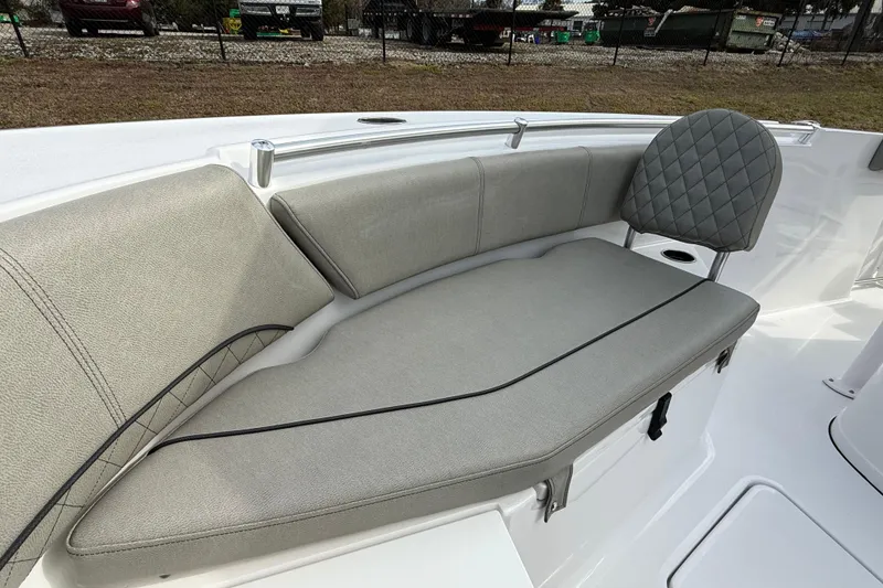 Slide: The Image of 2023 Sportsman Open 232 Center Console boat with cushioned seating and sleek design. - 19