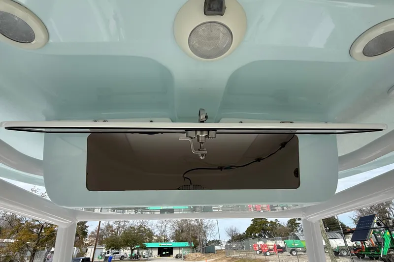 Slide: The Image of 2023 Sportsman Open 232 Center Console boat's overhead compartment detail. - 25