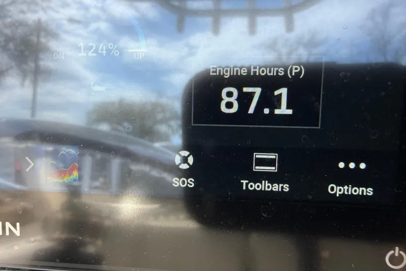 Slide: The Image of Display screen of 2023 Sportsman Open 232 Center Console showing 87.1 engine hours. - 26