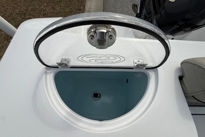 Slide: The Image of 2023 Sportsman Open 232 Center Console livewell with open lid, showcasing interior. - 30