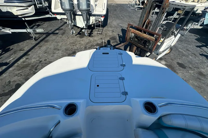 Slide: The Image of 2018 Starcraft Limited 2000 OB Fish boat deck with storage compartments and cup holders. - 12