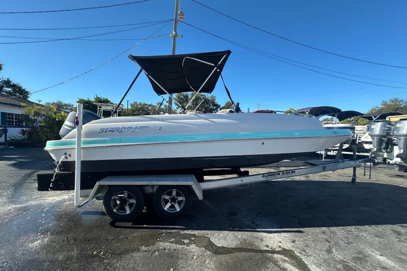 Slide: The Image of 2018 Starcraft Limited 2000 OB Fish boat on trailer, parked outdoors. - 3