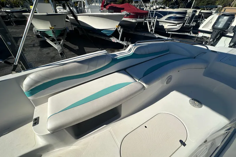 Slide: The Image of 2018 Starcraft Limited 2000 OB Fish boat interior with white and teal seating. - 7