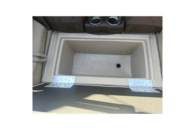 Slide: The Image of 2023 Bentley Pontoons 240 Navigator storage compartment with cup holders. - 7