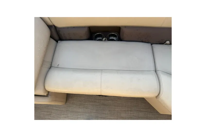 Slide: The Image of 2023 Bentley Pontoons 240 Navigator seating with cup holders, beige upholstery. - 8