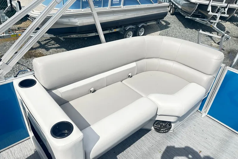 Slide: The Image of 2026 Godfrey EX 2286 SBX pontoon boat with plush seating and cup holders. - 8