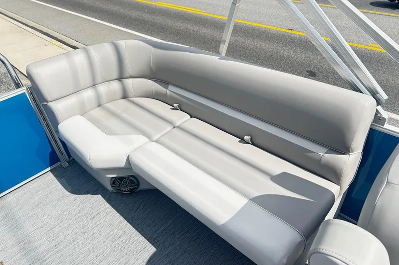 Slide: The Image of Luxurious seating on 2026 Godfrey EX 2286 SBX pontoon boat, featuring sleek gray upholstery. - 9