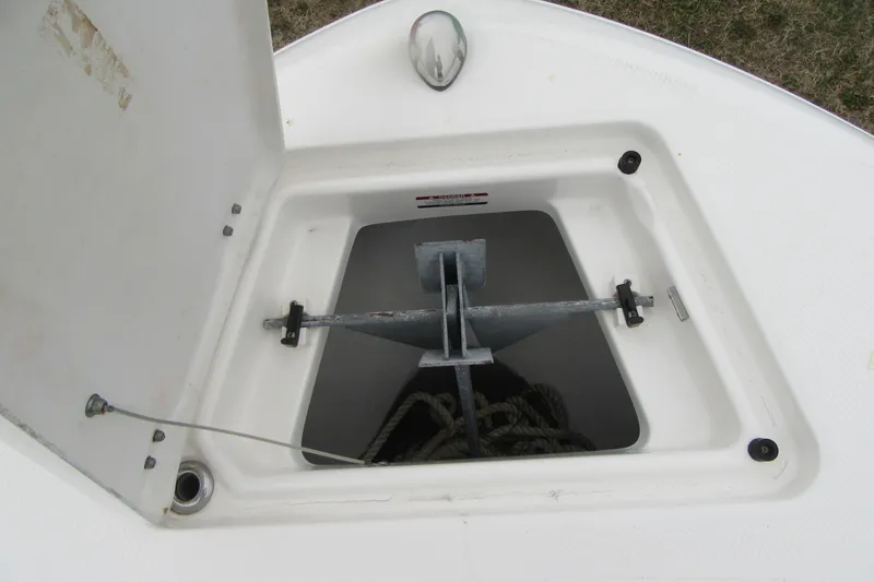 Slide: The Image of Open anchor compartment on 2015 Robalo R180 Center Console boat. - 11