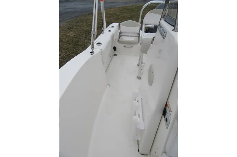 Slide: The Image of 2015 Robalo R180 Center Console boat interior with seating and rod holders. - 15