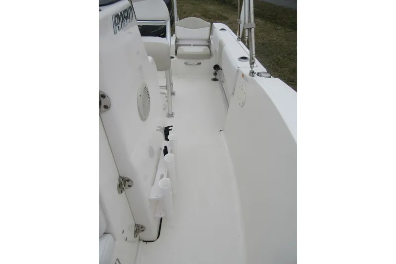 Slide: The Image of 2015 Robalo R180 Center Console boat interior with seating and storage features. - 16