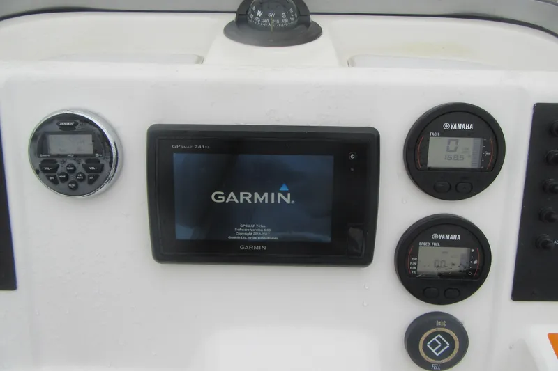 Slide: The Image of 2015 Robalo R180 Center Console dashboard with Garmin GPS and Yamaha gauges. - 19