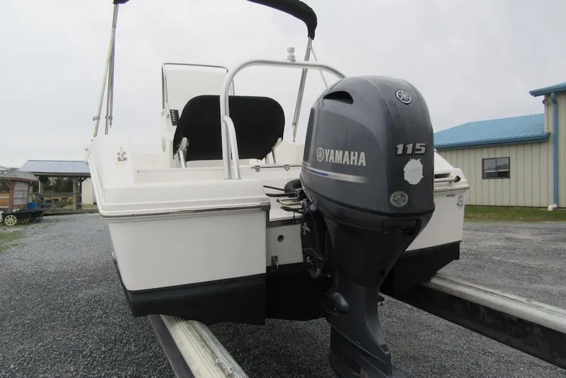 Slide: The Image of 2015 Robalo R180 Center Console with Yamaha 115 outboard engine on trailer. - 2