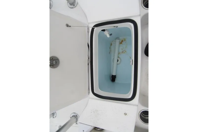 Slide: The Image of 2015 Robalo R180 Center Console livewell interior with open lid. - 21